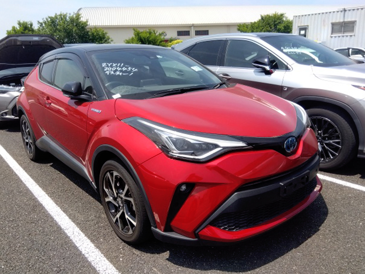 Car Planet1 Vibrant red 2019 Toyota C-HR G LED New Shape displayed in a parking lot, showcasing its sleek design and modern features at Car Planet