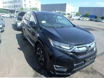 2020 Honda CR-V EX Masterpiece in black, featuring sleek design and modern headlights. The SUV is parked outdoors, ready for sale from Autocom Japan with reference number R00263419