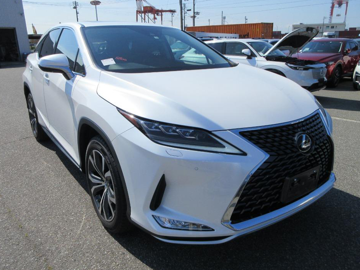 toyota lexus rx300h Front view of a white Toyota Lexus RX300H hybrid SUV, showcasing its sleek design and distinctive grille, parked in an outdoor car lot. This luxury vehicle emphasizes performance and eco-friendly features, ideal for premium car buyers.